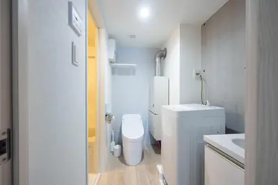 a small bathroom with a toilet and a sink at \u30ec\u30d4\u30e5\u30a2\u897f\u843d\u5408\u30ec\u30b8\u30c7\u30f3\u30b9 in Tokyo