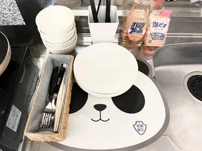 a kitchen counter with a panda plate and utensils at \u6c60\u888b\u96fb\u8eca2\u5206 2Rooms in Tokyo