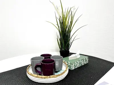 a tray with three cups and a plant on a table at \u6c60\u888b\u96fb\u8eca2\u5206 2Rooms in Tokyo