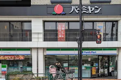 a store front of a building on a street at \u65b0\u5c0f\u5ca9\u9a7f\u7ad9 in Tokyo