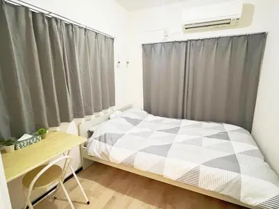 a small bedroom with a bed and a desk at \u6c60\u888b\u96fb\u8eca2\u52063Room 6\u4eba\u53ef in Tokyo