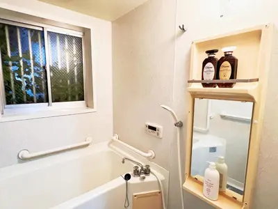 a bathroom with a tub and a sink and a window at \u6c60\u888b\u96fb\u8eca2\u52063Room 6\u4eba\u53ef in Tokyo