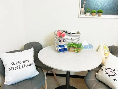 a small white table with a little toy on it at \u6c60\u888b\u96fb\u8eca2\u52063Room 6\u4eba\u53ef in Tokyo