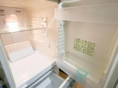 an empty refrigerator with its door open with the door open at \u9ad8\u7530\u99ac\u58344\u5206 4\u4eba\u53ef 203 in Tokyo