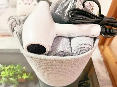 a basket filled with towels and a hair dryer at \u9ad8\u7530\u99ac\u58344\u5206 4\u4eba\u53ef 203 in Tokyo