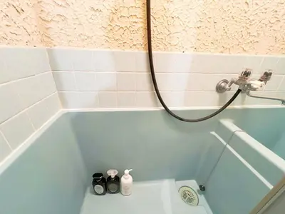 a bathroom with a blue tub with a shower at \u9ad8\u7530\u99ac\u58344\u5206 4\u4eba\u53ef 203 in Tokyo