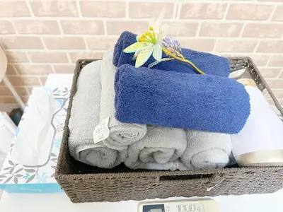 a basket filled with towels and a stuffed animal at 東新宿1分&新大久保10分 in Tokyo