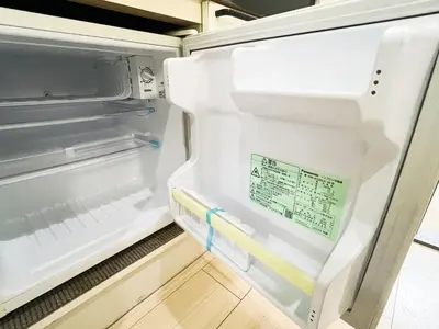 an empty refrigerator with its door open at \u5927\u585a\u99c55\u52064\u4eba\u53ef in Tokyo