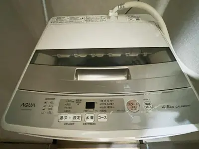 a close up of a washing machine in a room at \u5927\u585a\u99c55\u52064\u4eba\u53ef in Tokyo