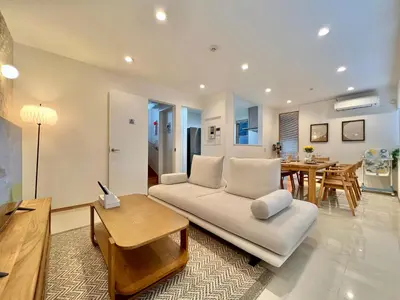 a living room with a couch and a table at MX Hotel Roppongi in Tokyo