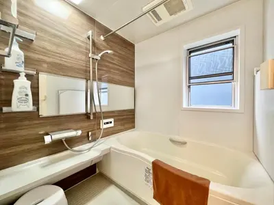 a bathroom with a tub and a toilet and a sink at MX Hotel Roppongi in Tokyo