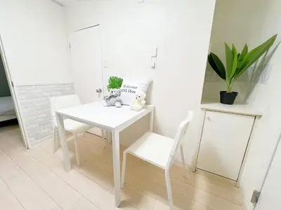 a white table and chairs with two stuffed animals on it at \u9ad8\u7530\u99ac\u58344\u5206 \u6700\u59277\u4eba 02 in Tokyo