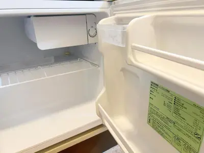 an open refrigerator with a sign on it at Ikebukuro Sugamo \u6700\u59274\u4ebaB5 in Tokyo