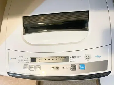 a white toaster oven sitting in a room at Ikebukuro Sugamo \u6700\u59274\u4ebaB5 in Tokyo