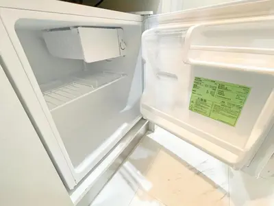an open refrigerator with a sign in the door at \u5c71\u624b\u7dda\u65b0\u5927\u4e45\u4fdd\u99c508 in Tokyo