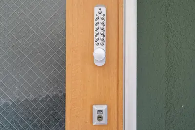 a close up of a door with a remote control at 65, Simotakaido A, Entire house for rent, \u4e0b\u9ad8\u4e95\u6238A in Tokyo