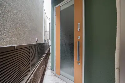 an open door to a building with a balcony at 65, Simotakaido A, Entire house for rent, \u4e0b\u9ad8\u4e95\u6238A in Tokyo