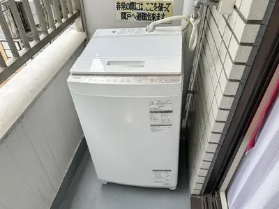 a washer and dryer sitting next to a building at TRAVELERZ Tokyo Akasaka in Tokyo