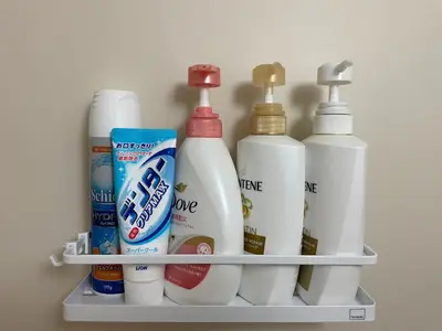 a shelf with four bottles of cleaning products on it at TRAVELERZ Tokyo Akasaka in Tokyo