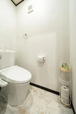 a white bathroom with a toilet and a trash can at 39, Kanegafuchi 2, Entire house for rent, \u9418\u30f6\u6df52 in Tokyo