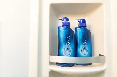 two blue bottles of soap sitting on a shelf at 39, Kanegafuchi 2, Entire house for rent, \u9418\u30f6\u6df52 in Tokyo