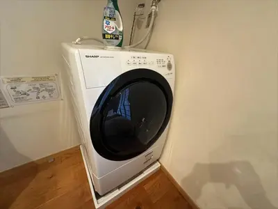 a washing machine in the corner of a room at Yadoya Suzume - Vacation STAY 60192v in Tokyo