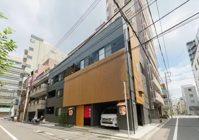 a building with a car parked inside of it at Yadoya Suzume - Vacation STAY 60198v in Tokyo