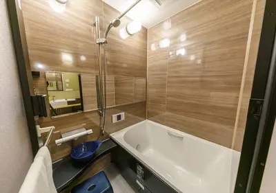 a bathroom with a tub and a toilet and a sink at Yadoya Suzume - Vacation STAY 60198v in Tokyo