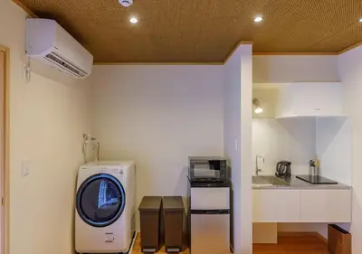 a kitchen with a washing machine in a room at Yadoya Suzume - Vacation STAY 60198v in Tokyo