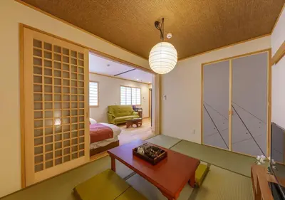 a living room with a couch and a table at Ydoya Fukuro - Vacation STAY 52727v in Tokyo