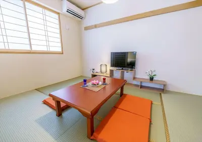 a living room with a table and a tv at Ydoya Fukuro - Vacation STAY 52727v in Tokyo