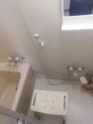 a white bathroom with a sink and a mirror at Tokyo downtown in Tokyo