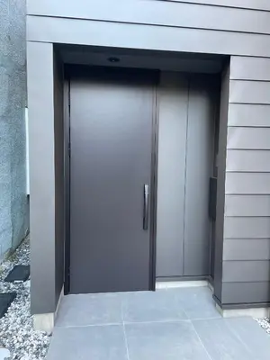 a pair of doors on the side of a building at Spacious Home in Ebisu Heart of Tokyo in Tokyo