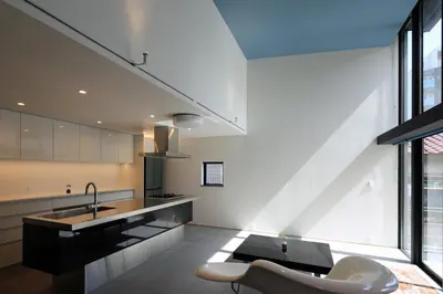 a kitchen with a sink and a table and a chair at Spacious Home in Ebisu Heart of Tokyo in Tokyo