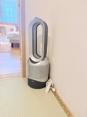 a television sitting in the corner of a room at \u6771\u4eac\u96f7\u9580\u30fc\u5343\u306e\u68eeAsakusa in Tokyo