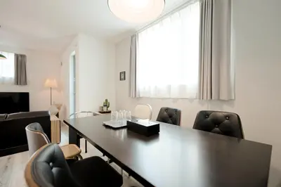 a dining room with a table and chairs at Mi-Villa Kami-Ikebukuro in Tokyo