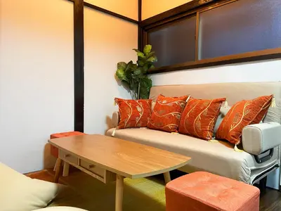 a living room with a couch and a table at 6min to subway, Skytree,Ueno,Asakusa within 20min in Tokyo