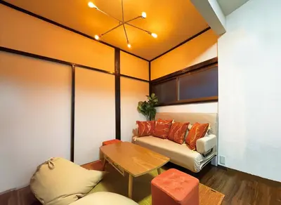 a living room with a couch and a table at 6min to subway, Skytree,Ueno,Asakusa within 20min in Tokyo
