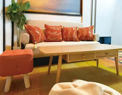 a living room with a couch and a wooden table at 6min to subway, Skytree,Ueno,Asakusa within 20min in Tokyo