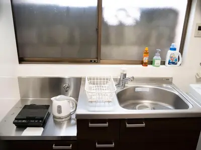 a small kitchen with a sink and a window at 6min to subway, Skytree,Ueno,Asakusa within 20min in Tokyo