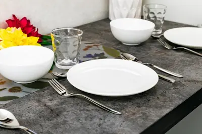 a table with white plates and silverware on it at 44, Sumiyoshi 2, Entire house for rent, \u4f4f\u54092 in Tokyo