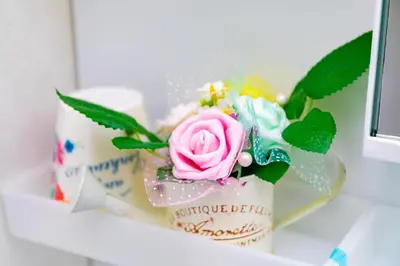 a bouquet of flowers in a container on a shelf at 44, Sumiyoshi 2, Entire house for rent, \u4f4f\u54092 in Tokyo