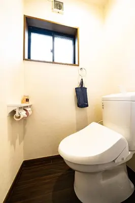 a bathroom with a white toilet and a window at 44, Sumiyoshi 2, Entire house for rent, \u4f4f\u54092 in Tokyo