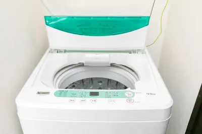 a washer and dryer sitting in a room at 44, Sumiyoshi 2, Entire house for rent, \u4f4f\u54092 in Tokyo