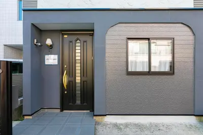 a house with a door and a window at 44, Sumiyoshi 2, Entire house for rent, \u4f4f\u54092 in Tokyo