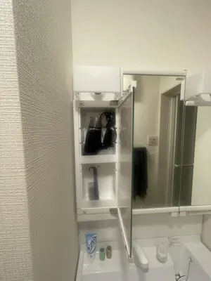 a bathroom with a mirror over a sink at The Ritz\u672c\u753a in Tokyo