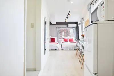 a room with white walls and a hallway with chairs at Shateray Yoyogi 501 SY51 in Tokyo