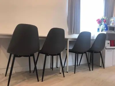 four chairs sitting next to a table in a kitchen at Shateray Yoyogi 501 SY51 in Tokyo