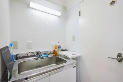 a kitchen with a stainless steel sink in a room at Shateray Yoyogi 501 SY51 in Tokyo
