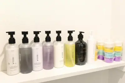 a row of bottles sitting on a shelf at SLEEPLAB Asakusa - Vacation STAY 13540v in Tokyo